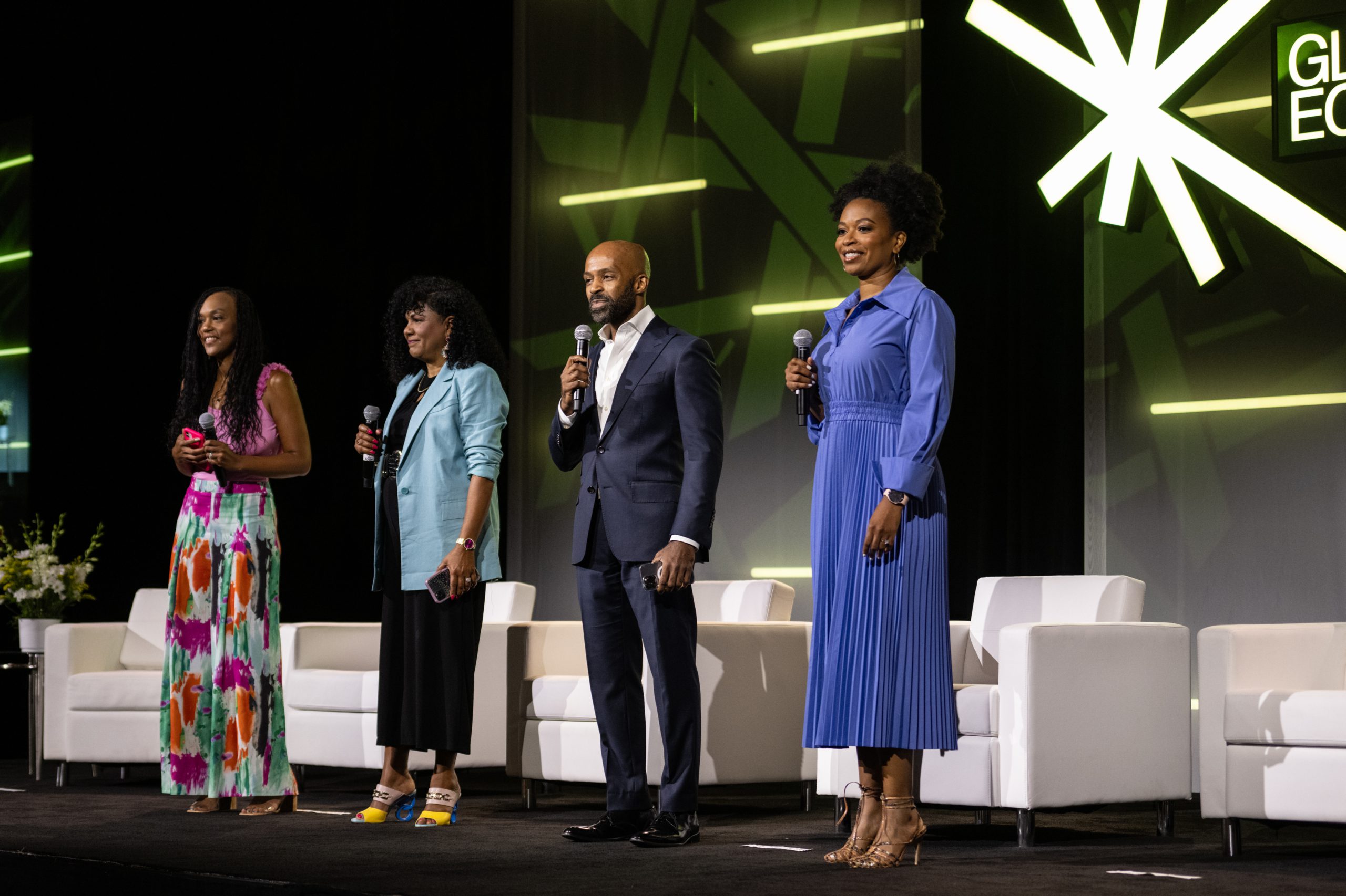 Photos of three Black women and one Black man on stage with white chairs in the background. 