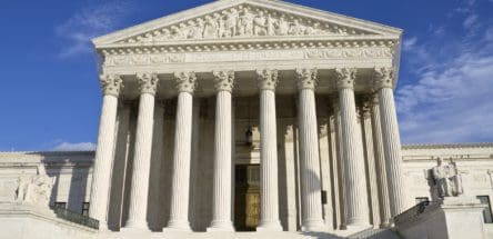 Picture of the Supreme Court building during the day.