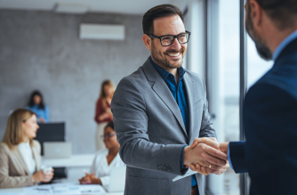 Shot,Of,Two,Businessmen,Shaking,Hands,In,An,Office.,Two Shot,Of,Two,Businessmen,Shaking,Hands,In,An,Office.,Two
