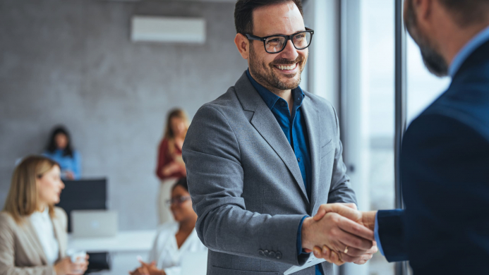 Shot,Of,Two,Businessmen,Shaking,Hands,In,An,Office.,Two Shot,Of,Two,Businessmen,Shaking,Hands,In,An,Office.,Two